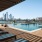 residents lounge in chairs around rooftop pool
